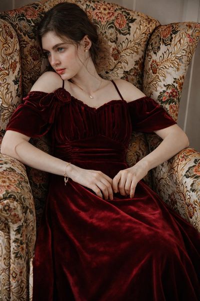 Elegance in Burgundy: A Portrait of Calm Beauty