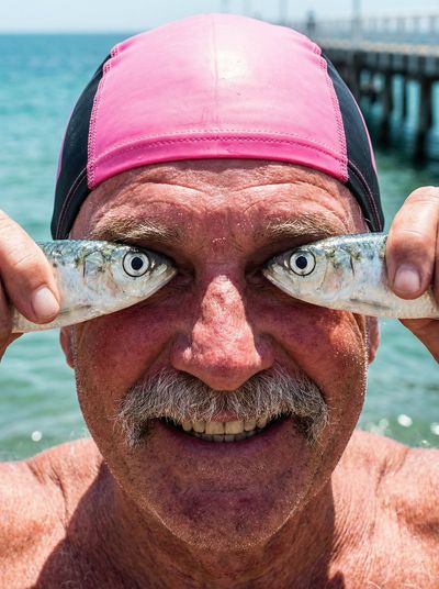 When Fish Eye Meets Human Eye: A Comedic Coastal Portrait
