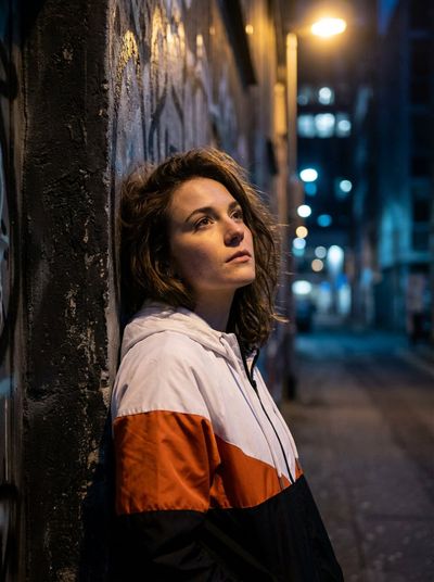 Silent Thoughts in a Vibrant Urban Glow