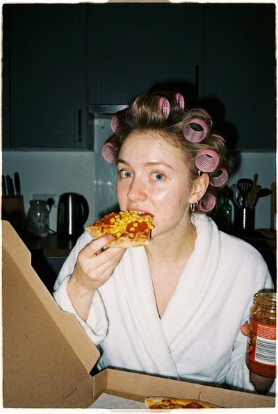 Candid Kitchen Delight: A Playful Pizza Moment