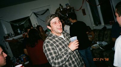 Nostalgia in Grain: A Chaotic 90s House Party Snapshot