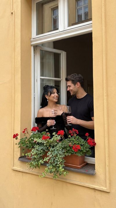 Charming Yellow Façade with Joyful Wine Lovers