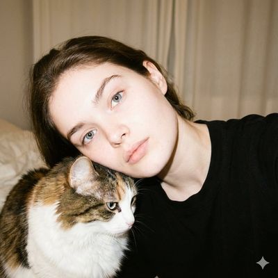 Intimate Portrait: Woman and Cat in Soft Glow