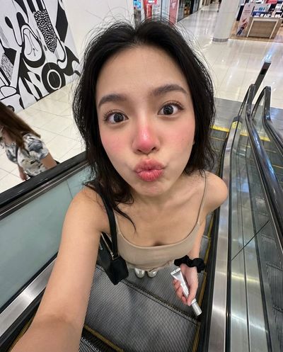 Escalator Antics: A Playful Selfie Moment