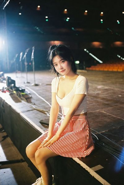 Whispers of Stardom: A K-Pop Idol's Intimate Stage Moment